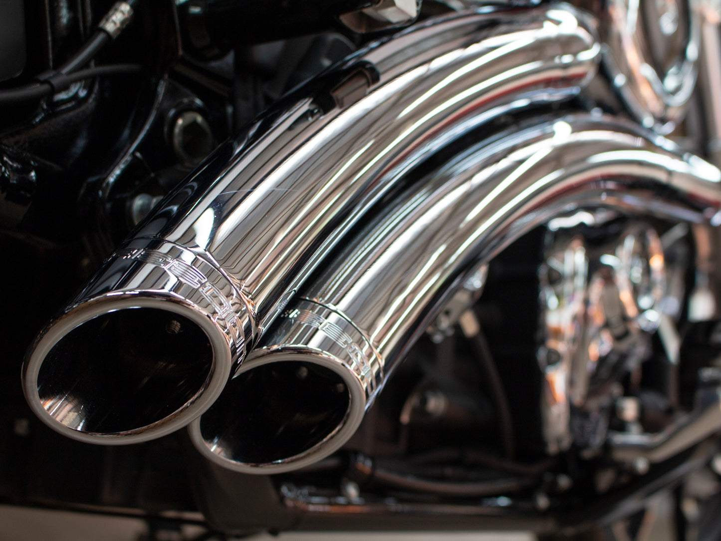 Radical Radius Exhaust - Chrome with Chrome End Caps. Fits Softail 2018up. - Freedom Performance Exhaust